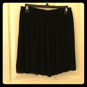 Black accordion pleated mini skirt. Size 8